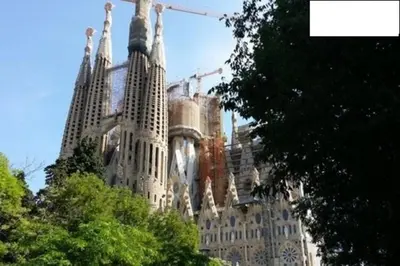 a building under construction with trees in front of it at Quiet apartment! Sagrada Familia! in Barcelona