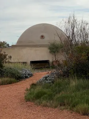 a building with a dome on the side of it at Hostal Porxos Garden in Barcelona