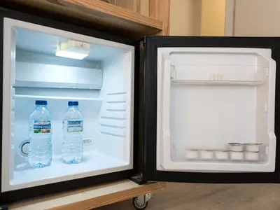 an open refrigerator with two bottles of water in it at Bruc & Bruc in Barcelona