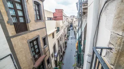 a view of an alley between two buildings at Welcomy Born in Barcelona
