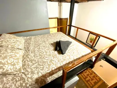 a bed with a pillow on it in a room at Apartamento de 3 habitaciones en Sants a 2`del metro Badal P9 in Barcelona