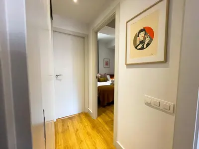a hallway with a door leading to a bedroom at Boutique Pare Lainez in Barcelona