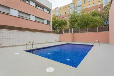 a swimming pool in the middle of a building at Pool LUXURY 2 Bedrooms - 2 Terraces - Parking - Long Term in Barcelona
