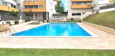a swimming pool in the yard of a building at Dolce Terrassa 25 min Barcelona and Beach in Terrassa