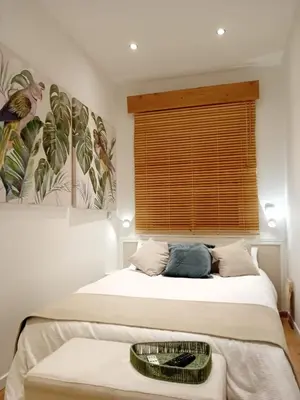two beds in a room with a window at Bonavista Montgat in Montgat