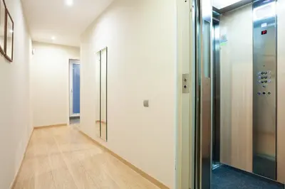 a hallway of an office with a glass elevator at Easysleep Borne in Barcelona