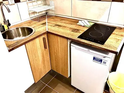 a small kitchen with a sink and a dishwasher at B3 planta baja al lado del metro in Barcelona