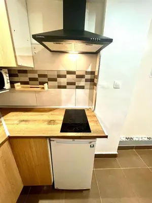 a kitchen with a stove and a counter top at B3 planta baja al lado del metro in Barcelona