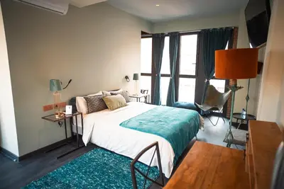 a bedroom with a bed and a large window at Hotel Lincoln Lounge in Barcelona