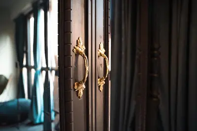 a door with a gold door knocker on a window at Hotel Lincoln Lounge in Barcelona