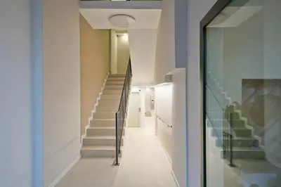 a hallway with stairs in a house at YOUR HOME- Apartment Camp Nou 1 in Hospitalet de Llobregat