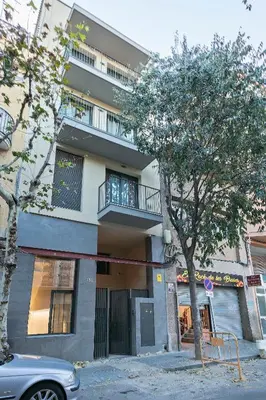 a building with a car parked in front of it at YOUR HOME- Apartment Camp Nou 2b in Hospitalet de Llobregat