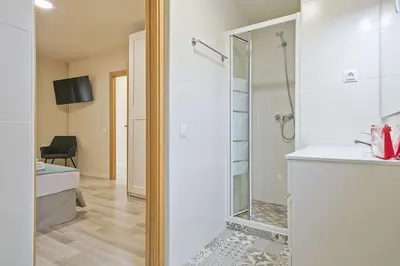 a living room with a couch and a tv at Alcam Baro SA in Barcelona