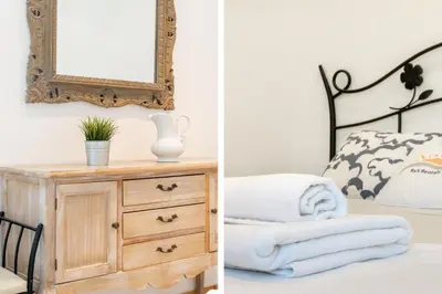 a bedroom with a dresser and a mirror at Romantic: Precioso frente al mar in Sitges