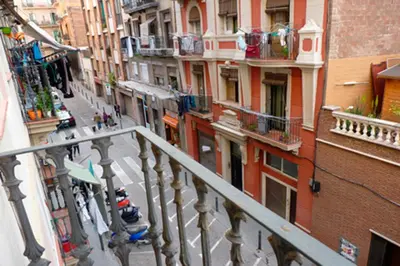 a view of a city street from a balcony at Cosmopolitan in Barcelona