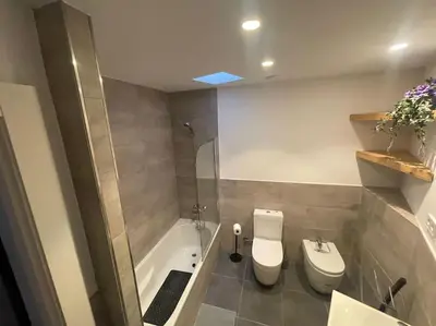 a bathroom with a toilet and a shower and a sink at House in Sant Cugat, 25 Mins to Barcelona center in Sant Cugat del Vallès