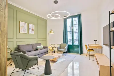 a living room with a couch and chairs at Anton's Downtown Apartment in Barcelona