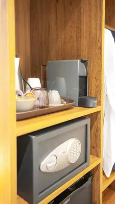 a microwave oven sitting on top of a shelf at Casa Pince in Barcelona
