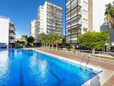 a swimming pool in the middle of some buildings at Apartment Cortijo Barques by Interhome in Sitges