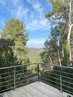 a building with stairs in front of it at night at Villa privada para grupos grandes cerca de Sitges Piscina terrazas y naturaleza in Olivella