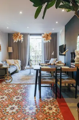 a living room with a couch and a table at En Ville Boutique Apartments Tamarit in Barcelona