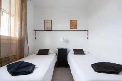 two beds sitting next to each other in a room at Lovely house in Bellaterra (10 min to UAB) in Cerdanyola del Valles