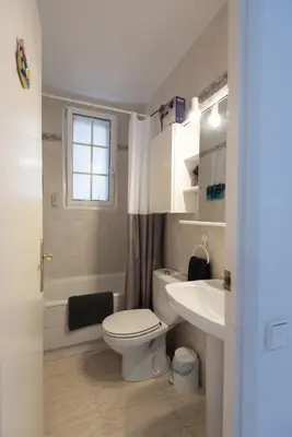 a bathroom with a toilet and a sink at Lovely house in Bellaterra (10 min to UAB) in Cerdanyola del Valles