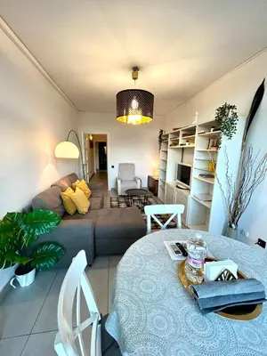 a living room with a couch and a table at Apartment Sagrera in Barcelona
