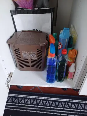 a cardboard box and bottles on a shelf at Apartamento entero en la montaña in El Pont de Vilomara