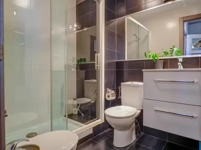 a bathroom with a toilet and a shower at Zafiro Apartment by Hello Homes Sitges in Sitges