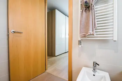 a bathroom with a toilet and a sink at Top family apartment by Lofties in Terrassa
