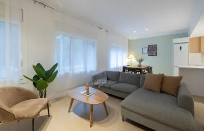 a living room with a couch and a table at Stay U-nique Apartments Putxet in Barcelona