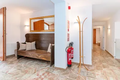 a living room with a couch and a fire hydrant at La Terraza - Großzügiges Appartment in Katalanischer Masia in Sant Iscle de Vallalta