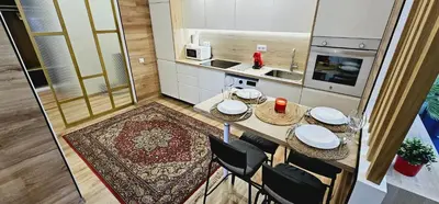 an overhead view of a kitchen with a table and chairs at Gran apartamento ideal grupos muy cerca Barcelona in Badalona