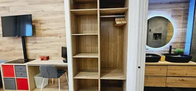 a room with a desk and a book shelf at Gran apartamento ideal grupos muy cerca Barcelona in Badalona
