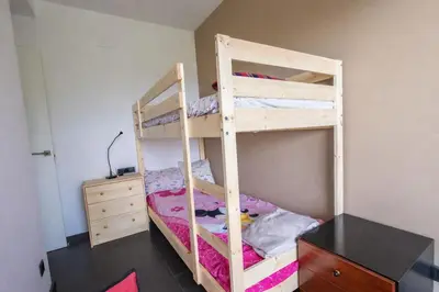 a bedroom with two bunk beds and a dresser at Catalunya Casas Modern Hilltop Haven with private pool 7km to beach in Castellet