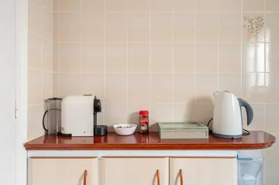 a kitchen counter with appliances on top of it at Apartamento 3 hab 15 minutos de Barcelona centro y 5 minutos playa in Sant Adria de Besos
