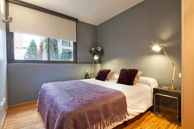 a bedroom with a bed and a window at My Space Emirates - Charming Duplex in Barcelona ideal for Families or Friends in Barcelona