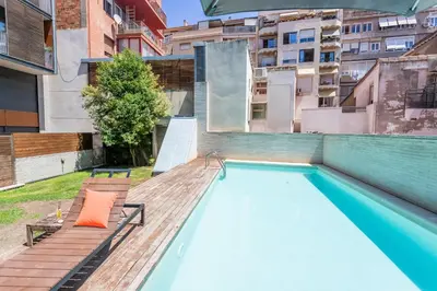 a swimming pool on the roof of a building at My Space Emirates - Splendid Apartment with Terrace and Pool near Park Güell in Barcelona