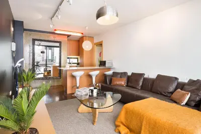 a living room with a couch and a table at My Space Emirates - Executive Apartments with Private Balcony in Barcelona