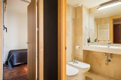 a bathroom with a toilet and a sink at My Space Emirates - Executive Apartments with Private Balcony in Barcelona