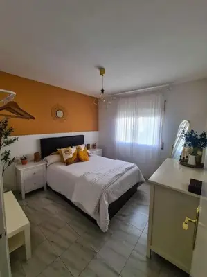 a bedroom with a bed with two pillows on it at Nice beachside 2-BD apt near Barcelona in Cunit