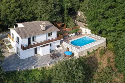an aerial view of a house with a swimming pool at Catalunya Casas Ultimate tranquility in rural Costa Brava! in Tordera