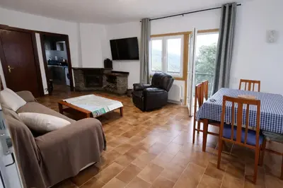 a living room with a couch and a table at Catalunya Casas Ultimate tranquility in rural Costa Brava! in Tordera