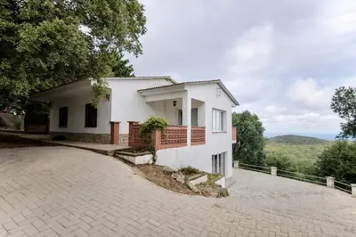 a white house with a driveway at Catalunya Casas Ultimate tranquility in rural Costa Brava! in Tordera