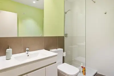 a bathroom with a toilet and a sink and a shower at Stay U-nique Apartments Vila de Gracia II in Barcelona