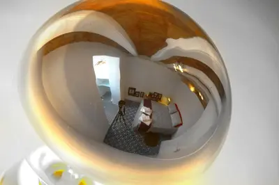 a reflection of a living room in a glass ball at Casa Tortilla Sant Antoni in Barcelona