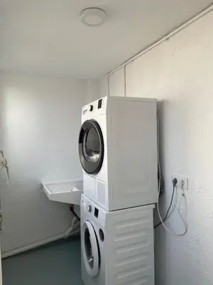 a washer and dryer in the corner of a room at Barri Vell 4 in Manresa