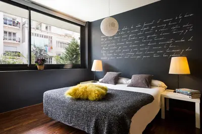 a bedroom with a bed with a furry pillow on it at My Space Emirates - Modern Duplex with Private Garden and Swimming Pool in Barcelona