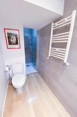 a bathroom with a toilet and a shower at Anna & Thomas - Sitges Center Apt in Sitges